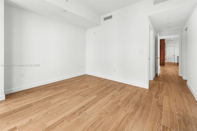 empty room featuring light hardwood / wood-style floors