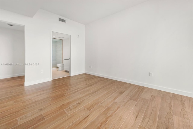 unfurnished bedroom featuring ensuite bathroom