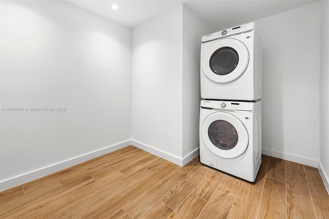 washroom with stacked washer and dryer