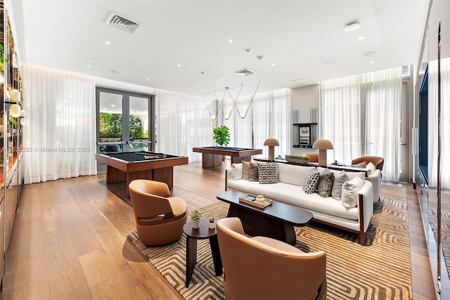 interior space featuring light wood-type flooring and pool table