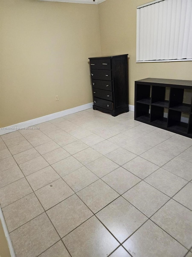 unfurnished bedroom with light tile patterned floors