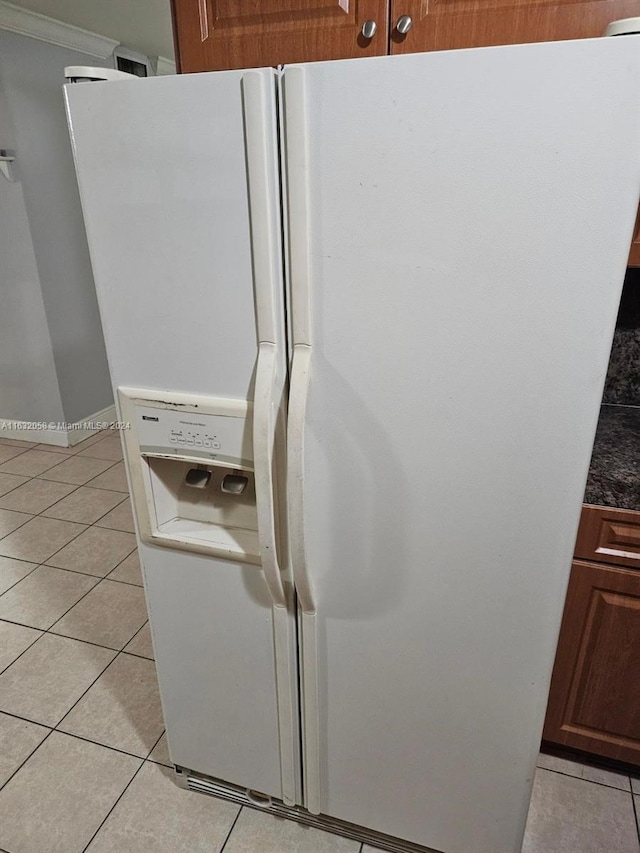 room details featuring white refrigerator with ice dispenser