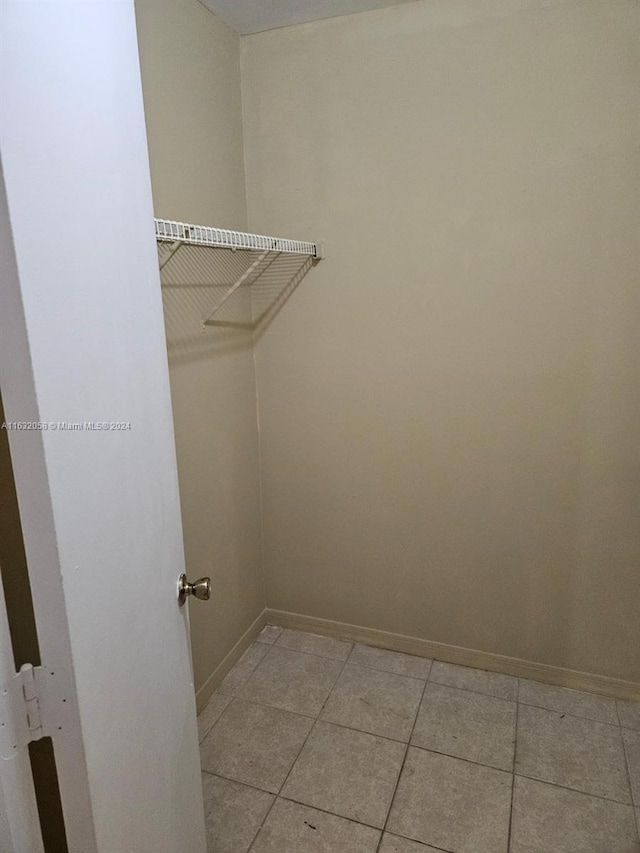 laundry room with light tile patterned floors