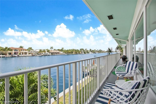 balcony featuring a water view