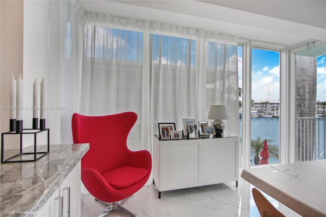 sitting room featuring a water view