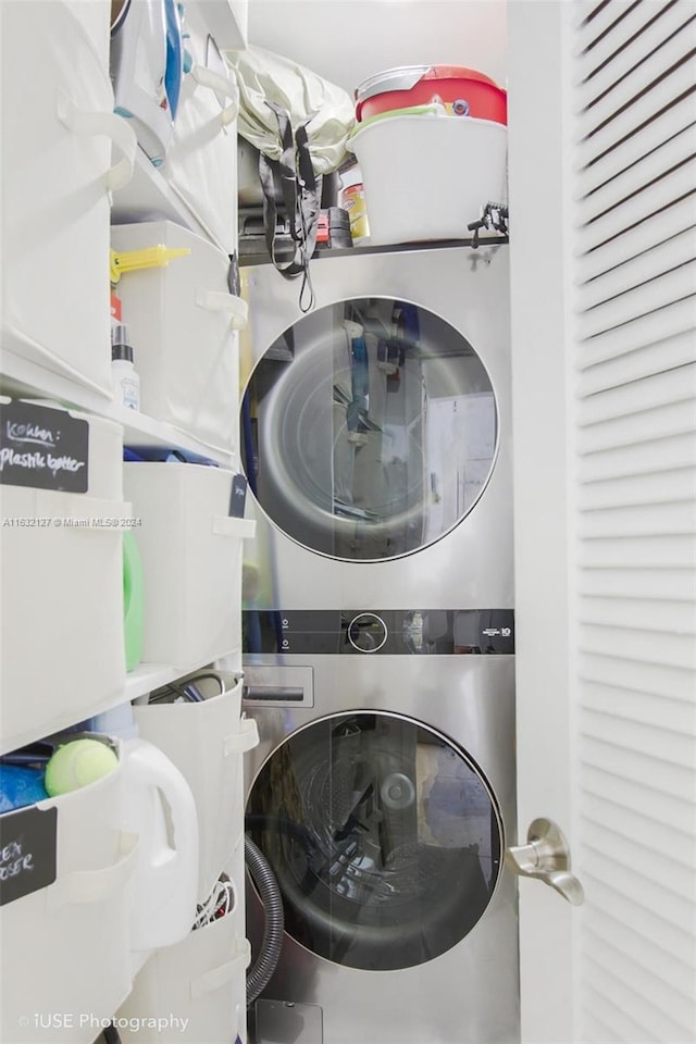 washroom with stacked washer and clothes dryer