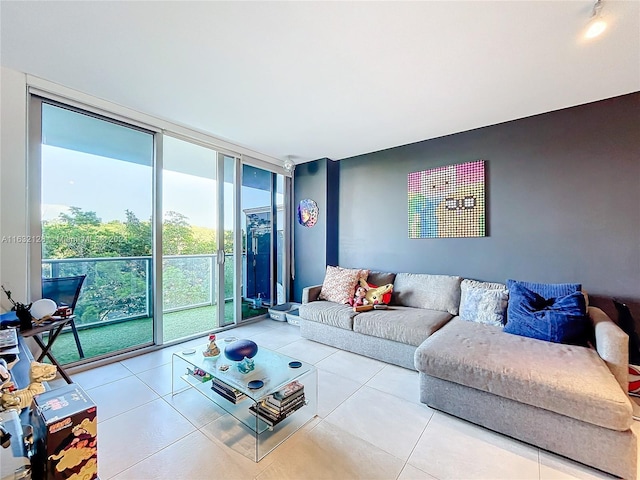 tiled living room featuring floor to ceiling windows