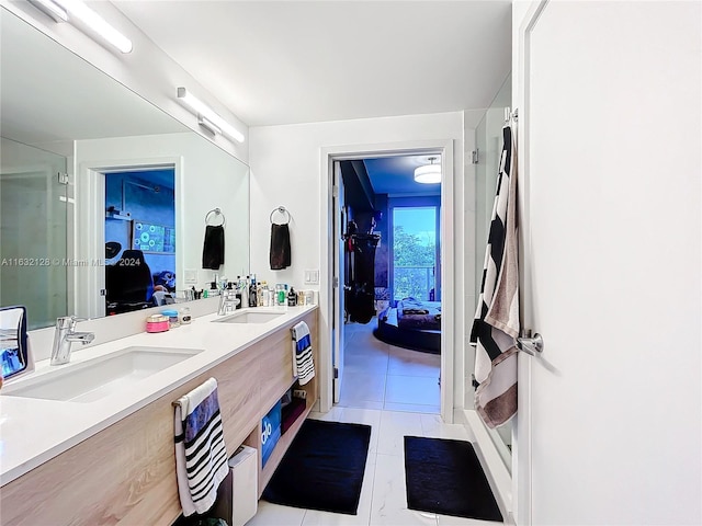 bathroom with an enclosed shower, tile patterned flooring, and dual bowl vanity