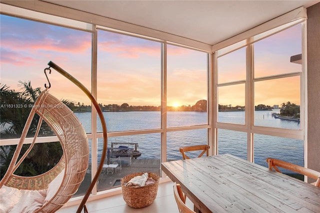 sunroom with a water view