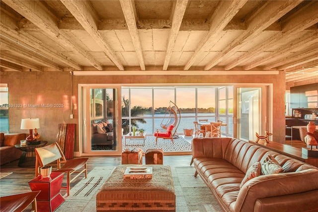 sunroom with a water view and wooden ceiling