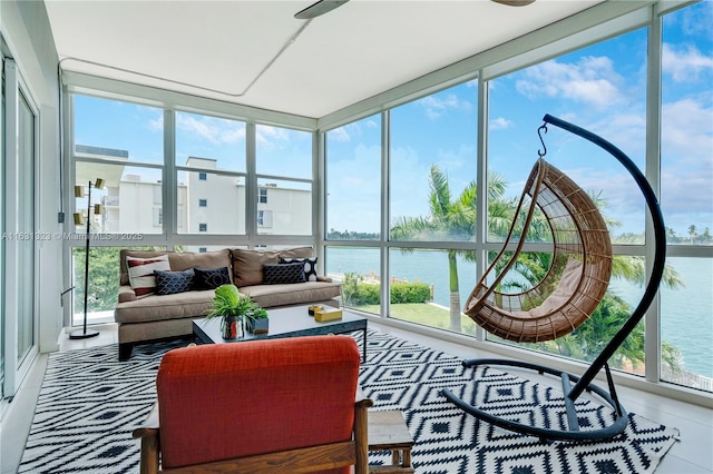 sunroom / solarium with a water view