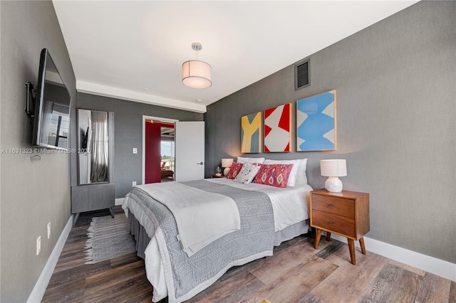 bedroom with wood-type flooring