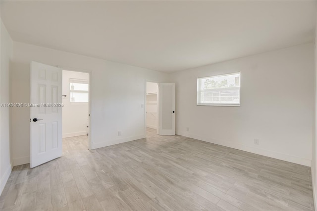 empty room with light wood-type flooring