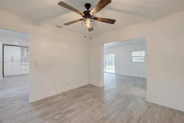 spare room with ceiling fan and light hardwood / wood-style floors