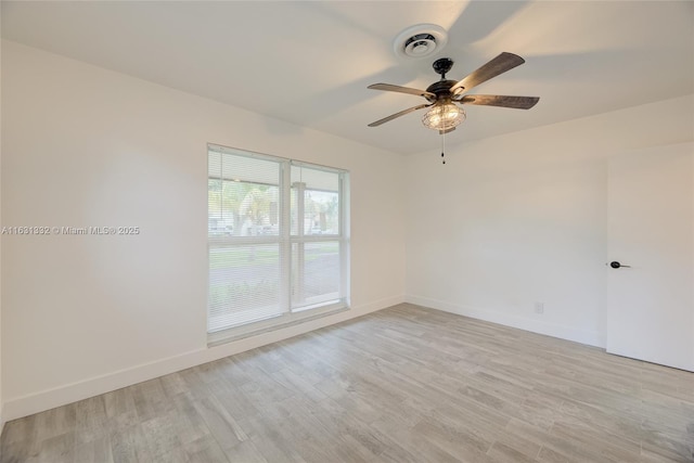 spare room with ceiling fan and light hardwood / wood-style flooring