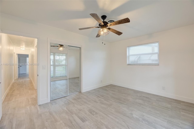 empty room featuring light hardwood / wood-style floors and ceiling fan