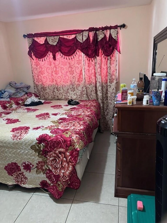 bedroom featuring light tile patterned flooring