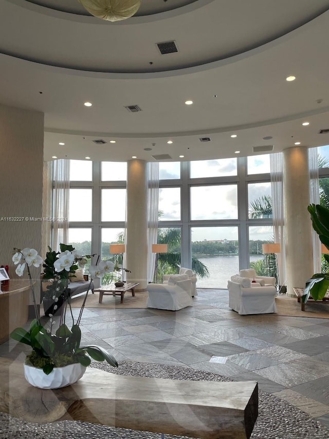 building lobby featuring a water view