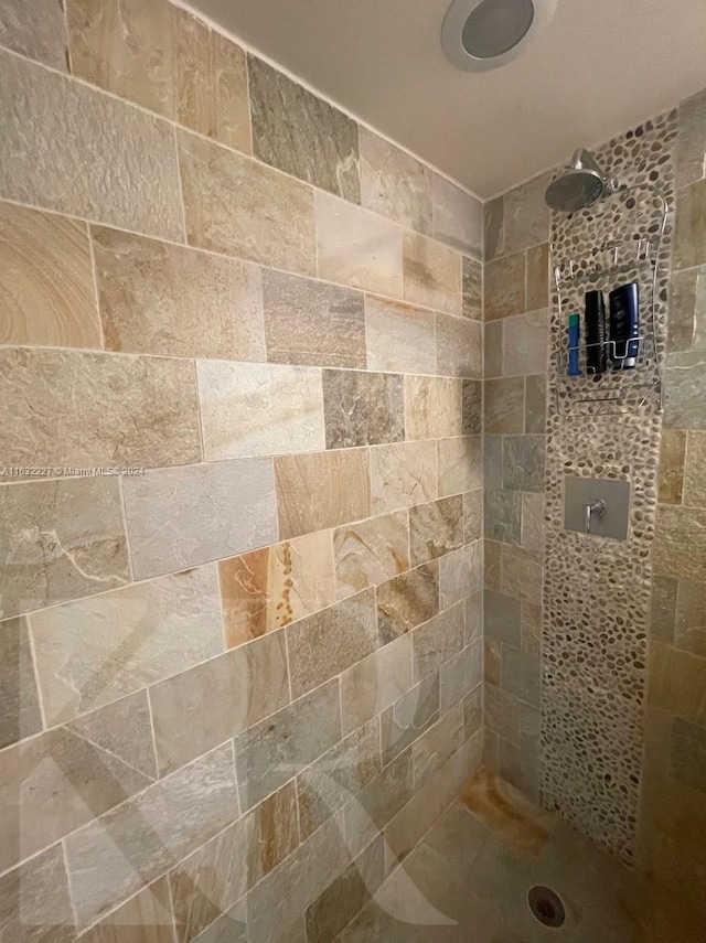 bathroom with tiled shower