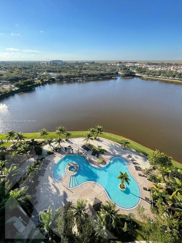 exterior space featuring a water view and a patio area