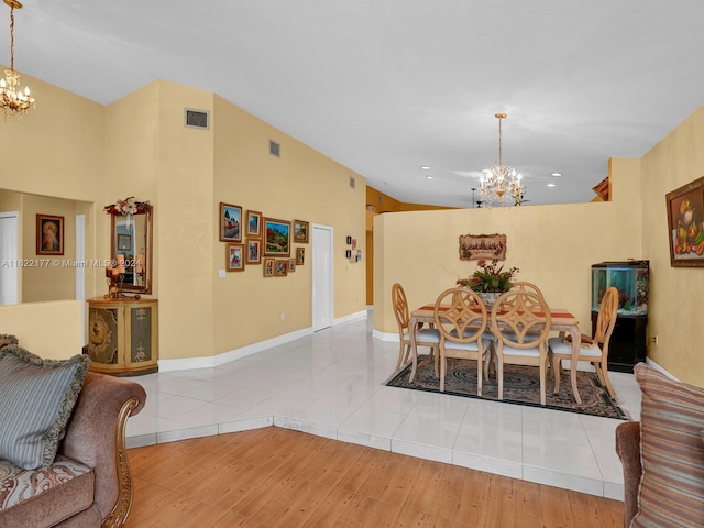 dining room featuring a notable chandelier and light hardwood / wood-style floors