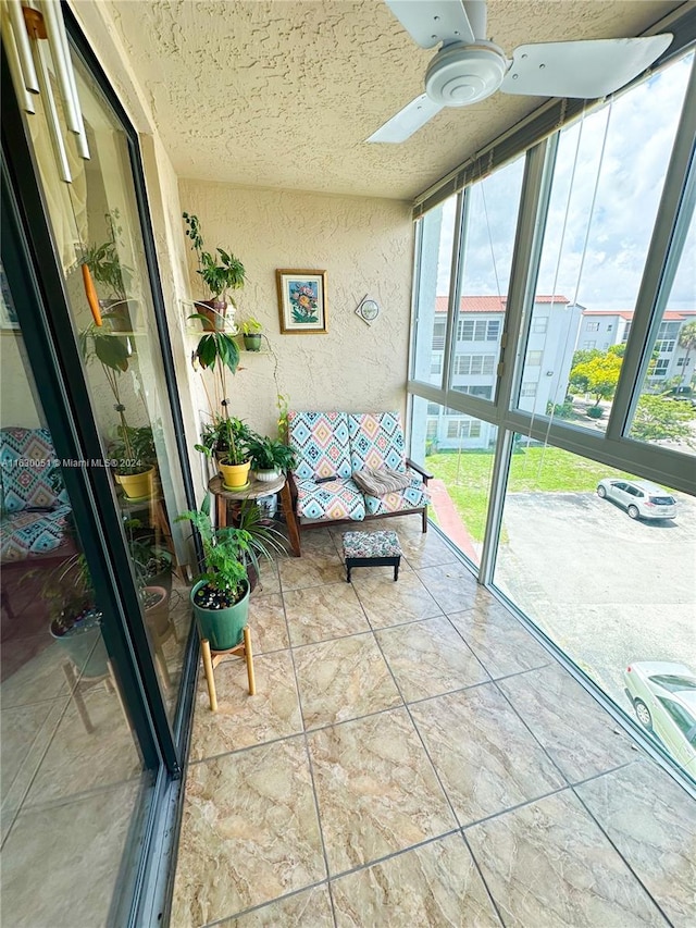 sunroom / solarium with ceiling fan