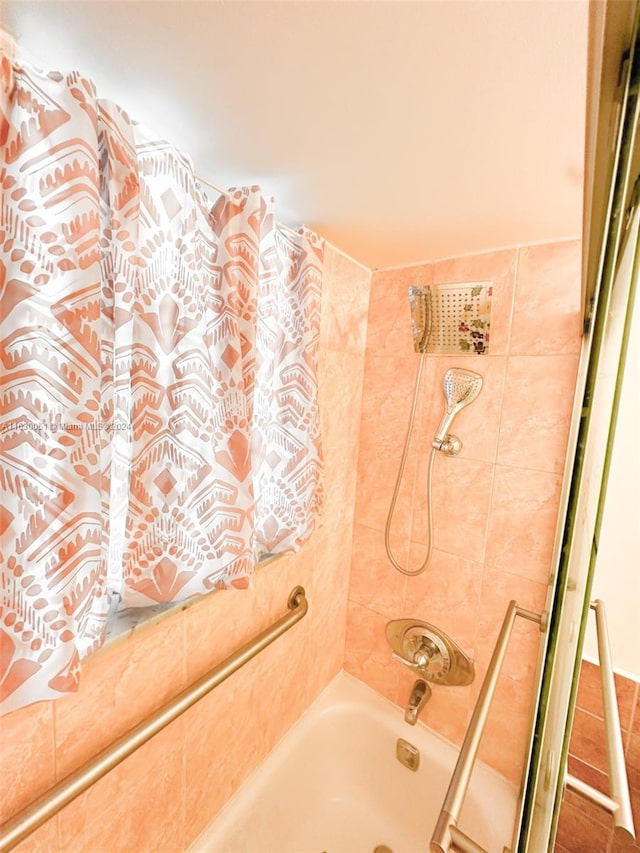 bathroom featuring shower / tub combo with curtain