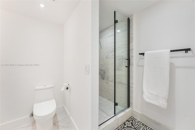 bathroom with toilet, an enclosed shower, and tile patterned flooring