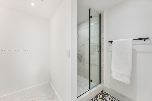 full bath with marble finish floor, a shower stall, baseboards, and recessed lighting