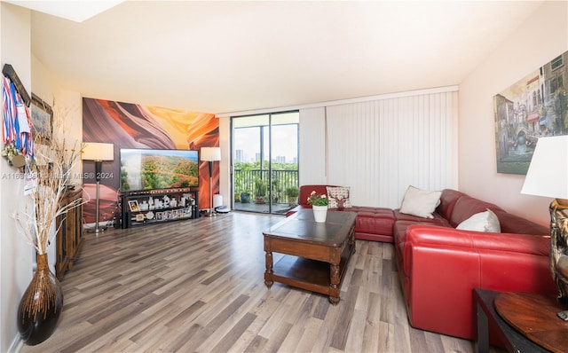 living room with wood-type flooring and expansive windows