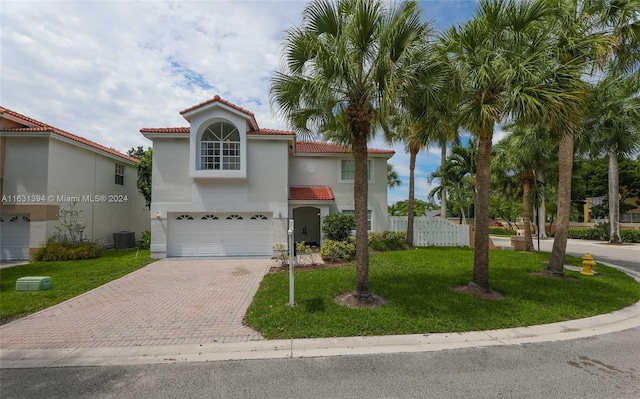 13377 NW 7th St, Plantation, FL 33325 - mediterranean / spanish house with a garage, stucco siding, central AC, and decorative driveway