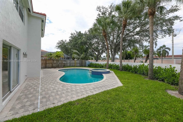 13377 NW 7th St, Plantation, FL 33325 - view of swimming pool with a fenced backyard, a yard, a patio area, and a pool with connected hot tub