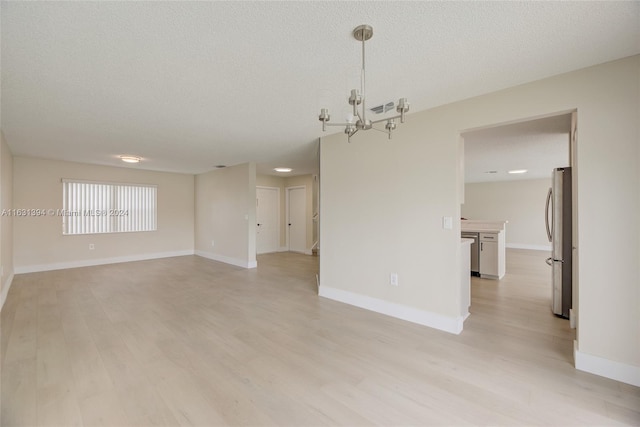 13377 NW 7th St, Plantation, FL 33325 - empty room featuring an inviting chandelier, light wood-style floors, baseboards, and visible vents