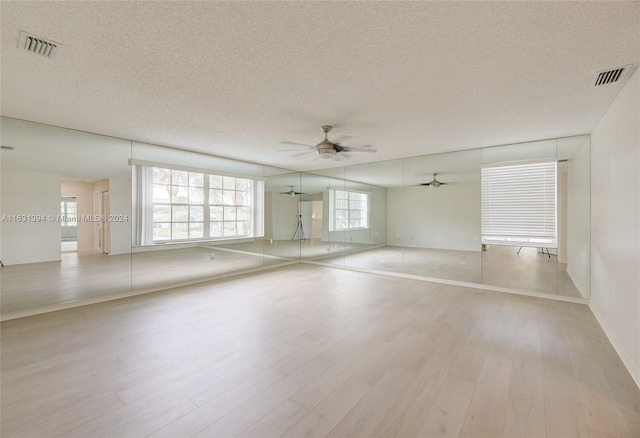 13377 NW 7th St, Plantation, FL 33325 - unfurnished room featuring a textured ceiling, ceiling fan, wood finished floors, and visible vents