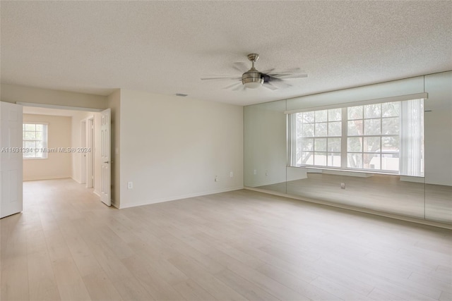 13377 NW 7th St, Plantation, FL 33325 - spare room with a ceiling fan, a textured ceiling, baseboards, and light wood-type flooring