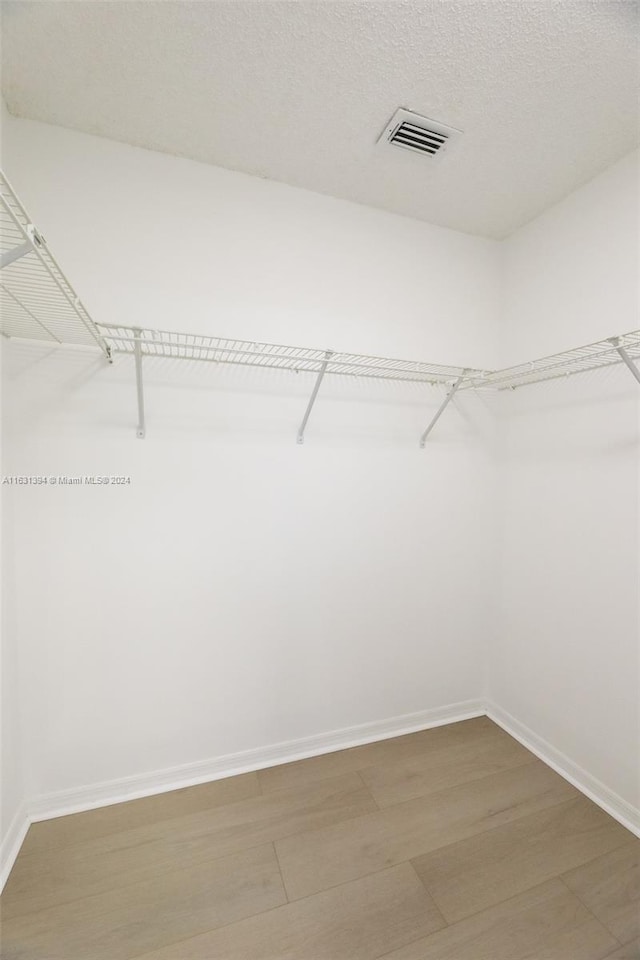 13377 NW 7th St, Plantation, FL 33325 - walk in closet featuring visible vents and light wood finished floors