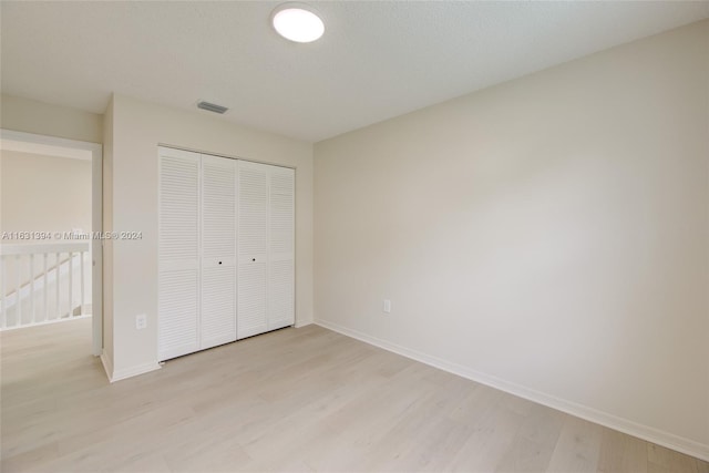 13377 NW 7th St, Plantation, FL 33325 - unfurnished bedroom with a closet, baseboards, visible vents, and light wood-style floors
