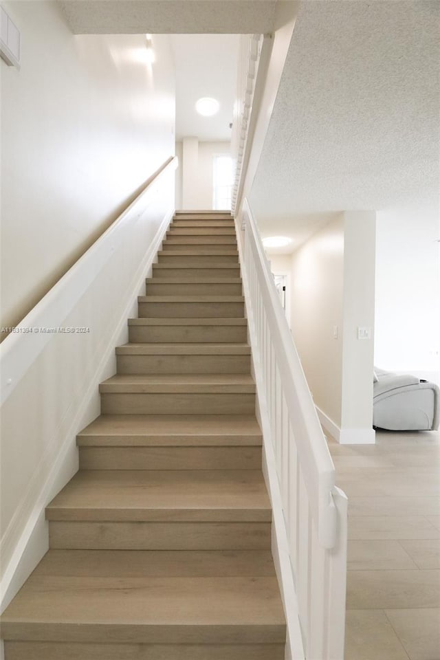 13377 NW 7th St, Plantation, FL 33325 - stairway with baseboards and wood finished floors
