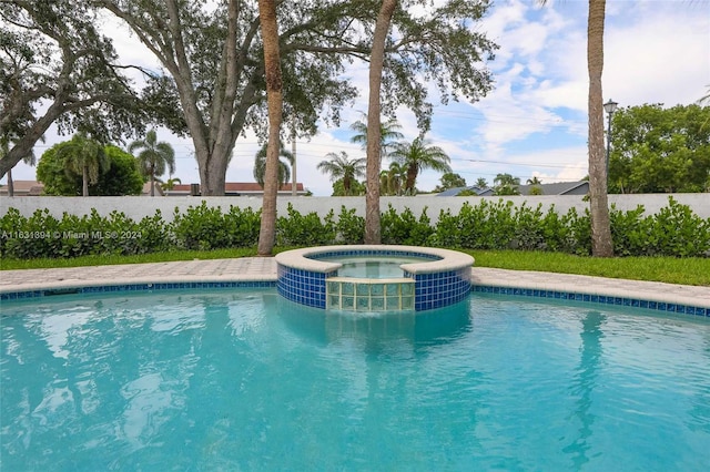 13377 NW 7th St, Plantation, FL 33325 - view of pool featuring central AC, fence, and a pool with connected hot tub