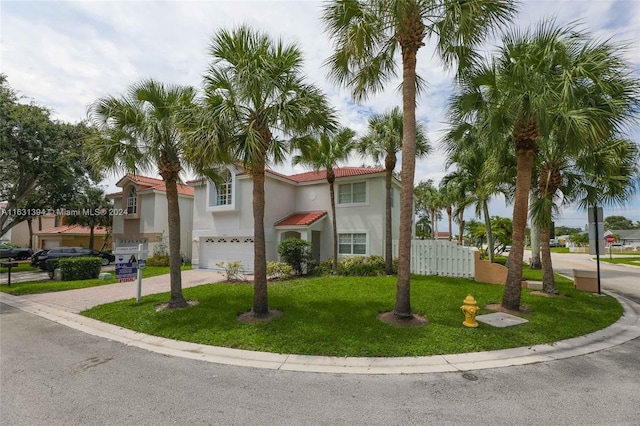 13377 NW 7th St, Plantation, FL 33325 - view of front of home with driveway, a front yard, fence, an attached garage, and stucco siding