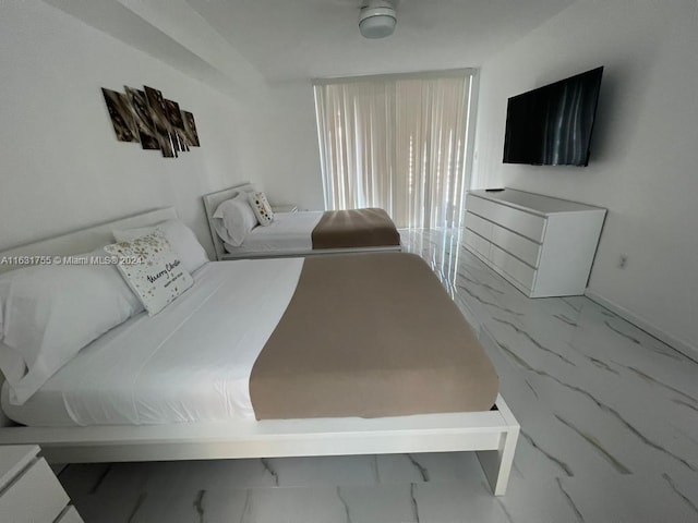 bedroom featuring light tile patterned flooring