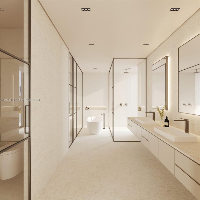 bathroom featuring double sink vanity and a bidet