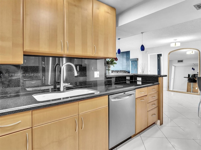 kitchen featuring dark stone counters, sink, decorative backsplash, light tile patterned flooring, and dishwasher