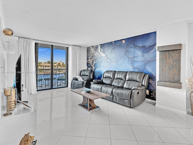 living room featuring a textured ceiling and light tile patterned floors