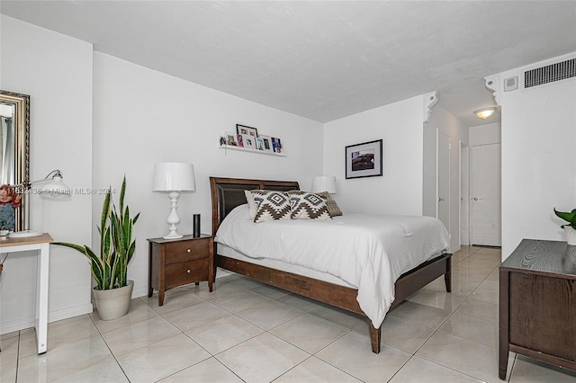 bedroom featuring light tile patterned floors