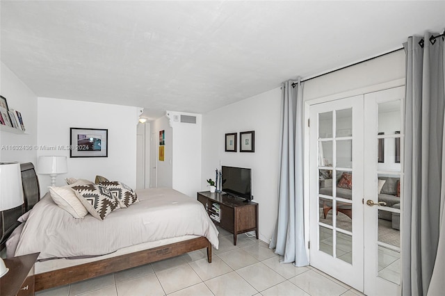 tiled bedroom with french doors