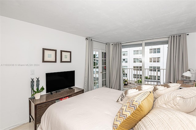 bedroom featuring access to exterior and expansive windows