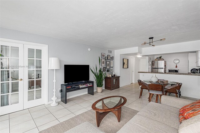 tiled living room with french doors