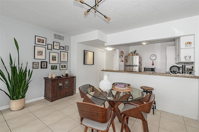 dining area with light tile patterned floors