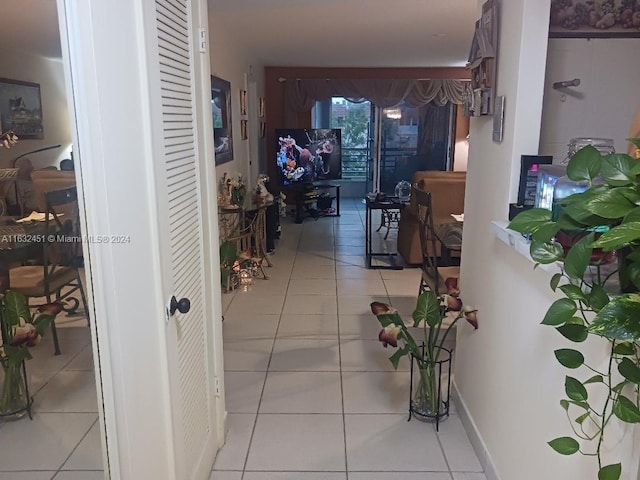 corridor featuring light tile patterned floors